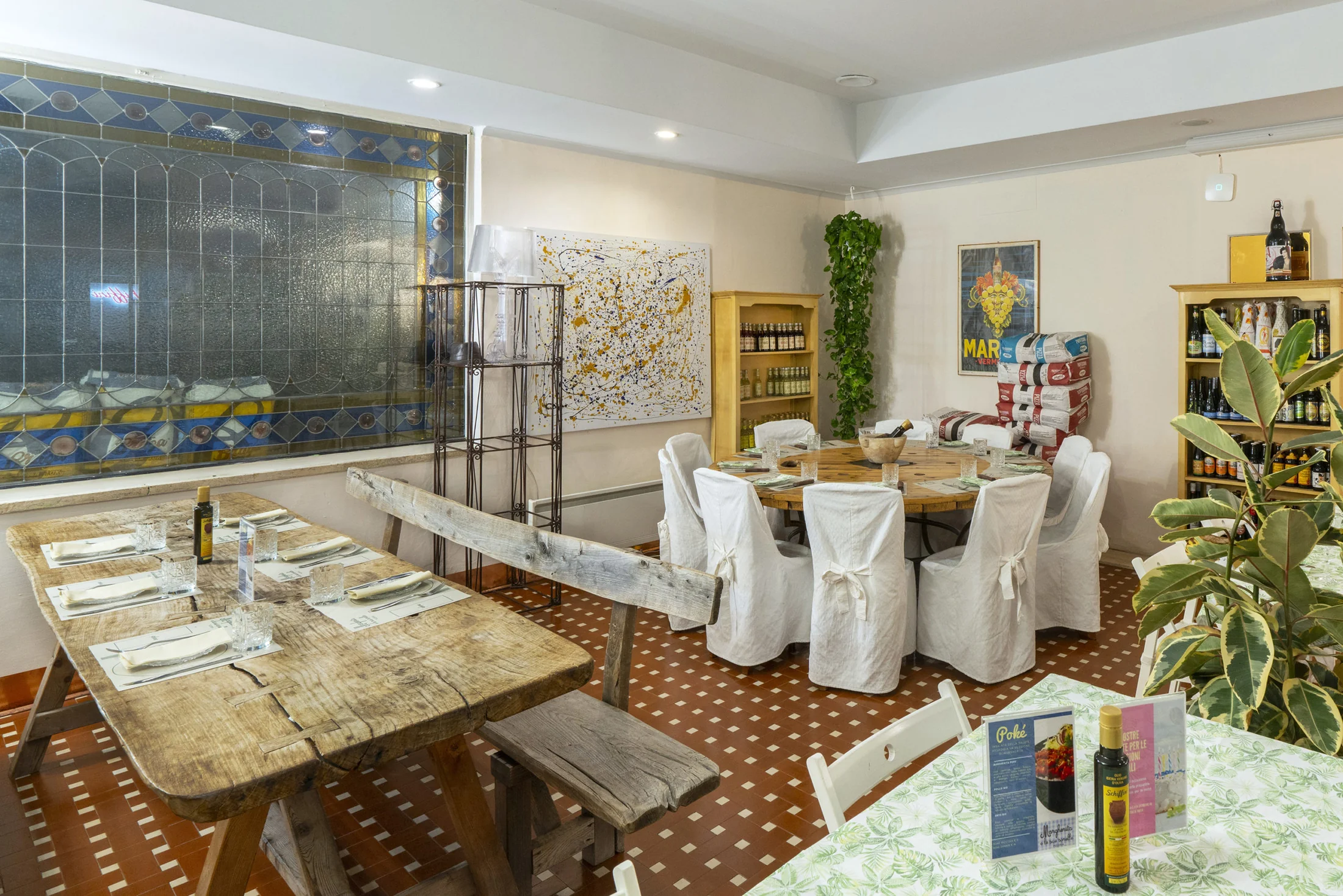 Dining room with rustic tables and wall art