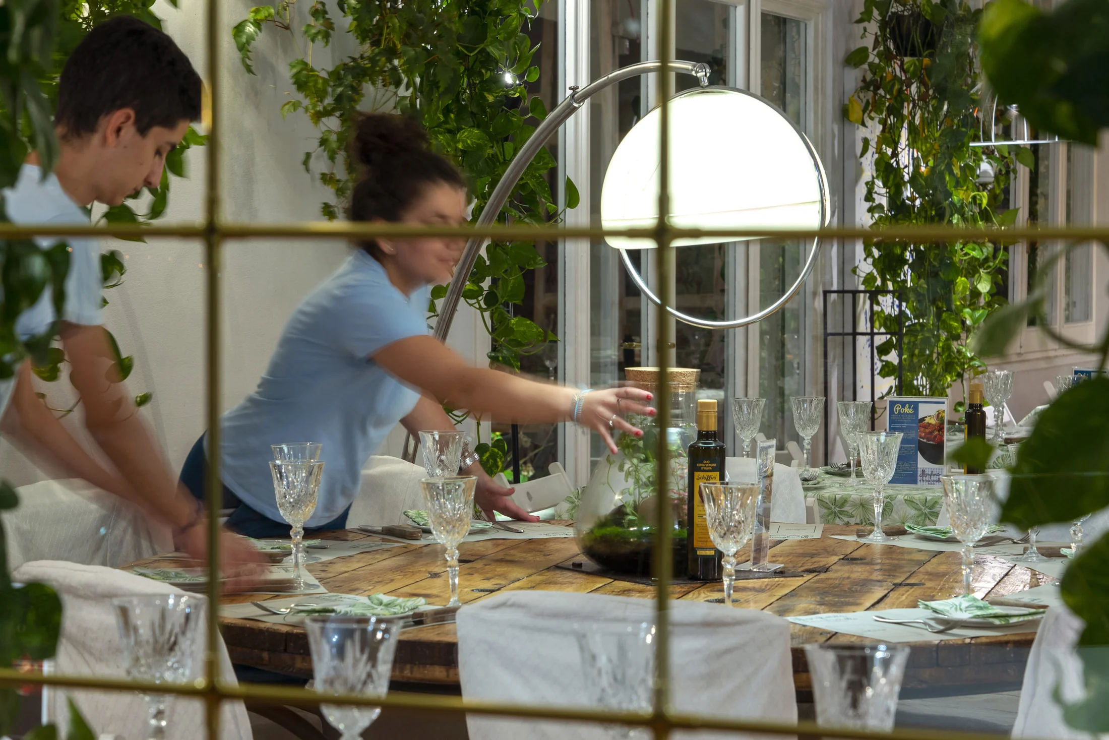 Restaurant staff preparing the dining room